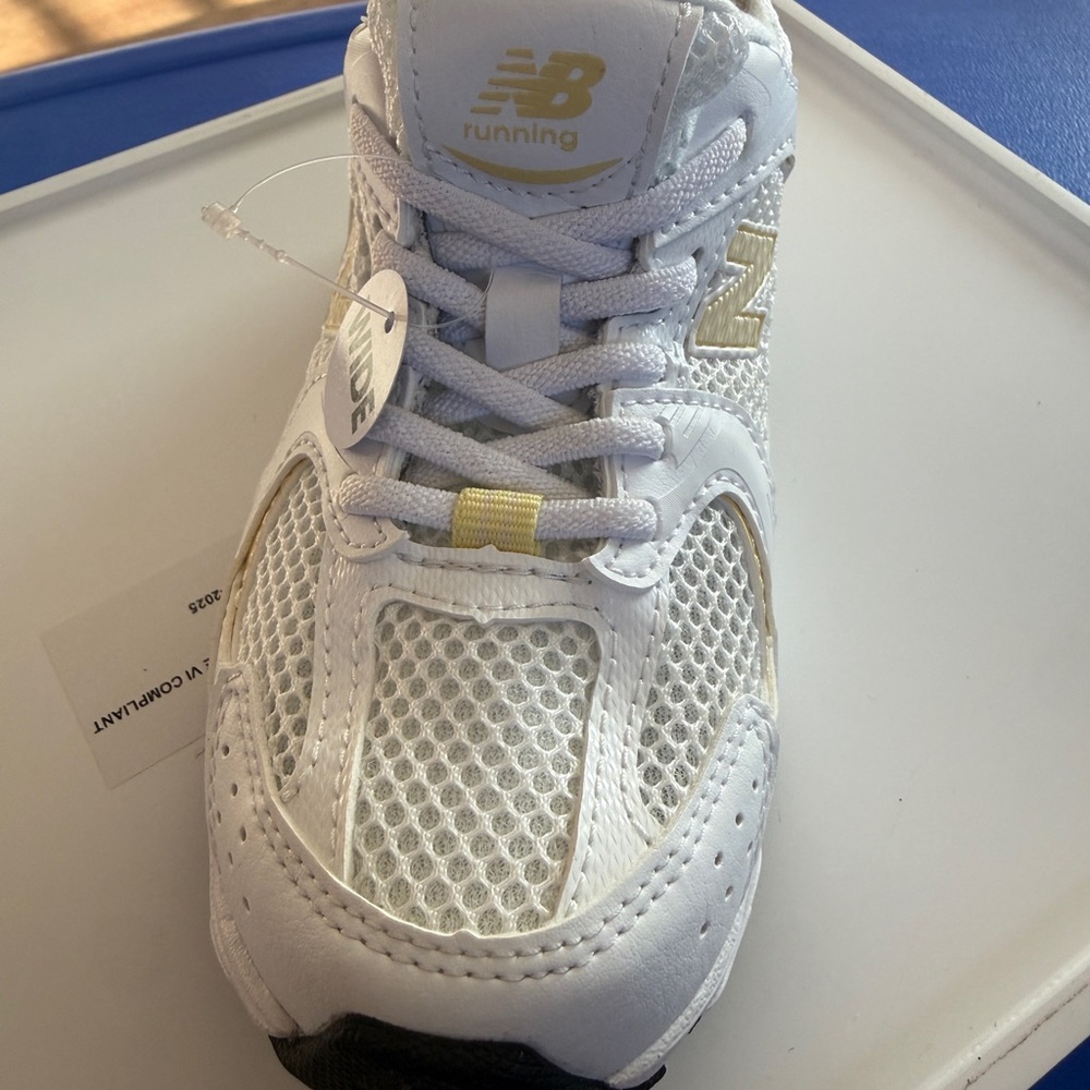 New Balance Kids White and Gold Athletic Sneakers
